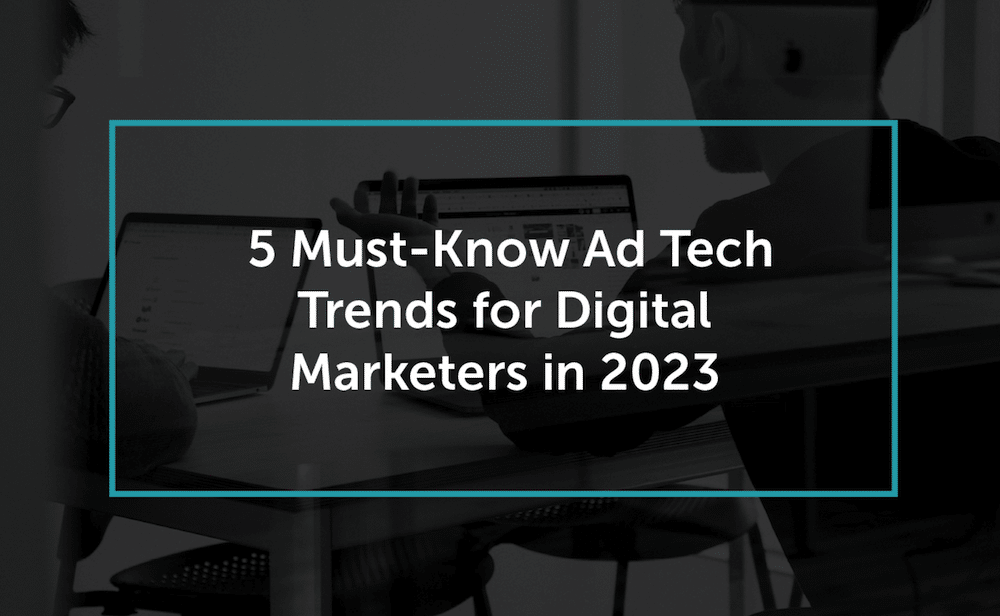 Two people discussing ad tech trends at a desk