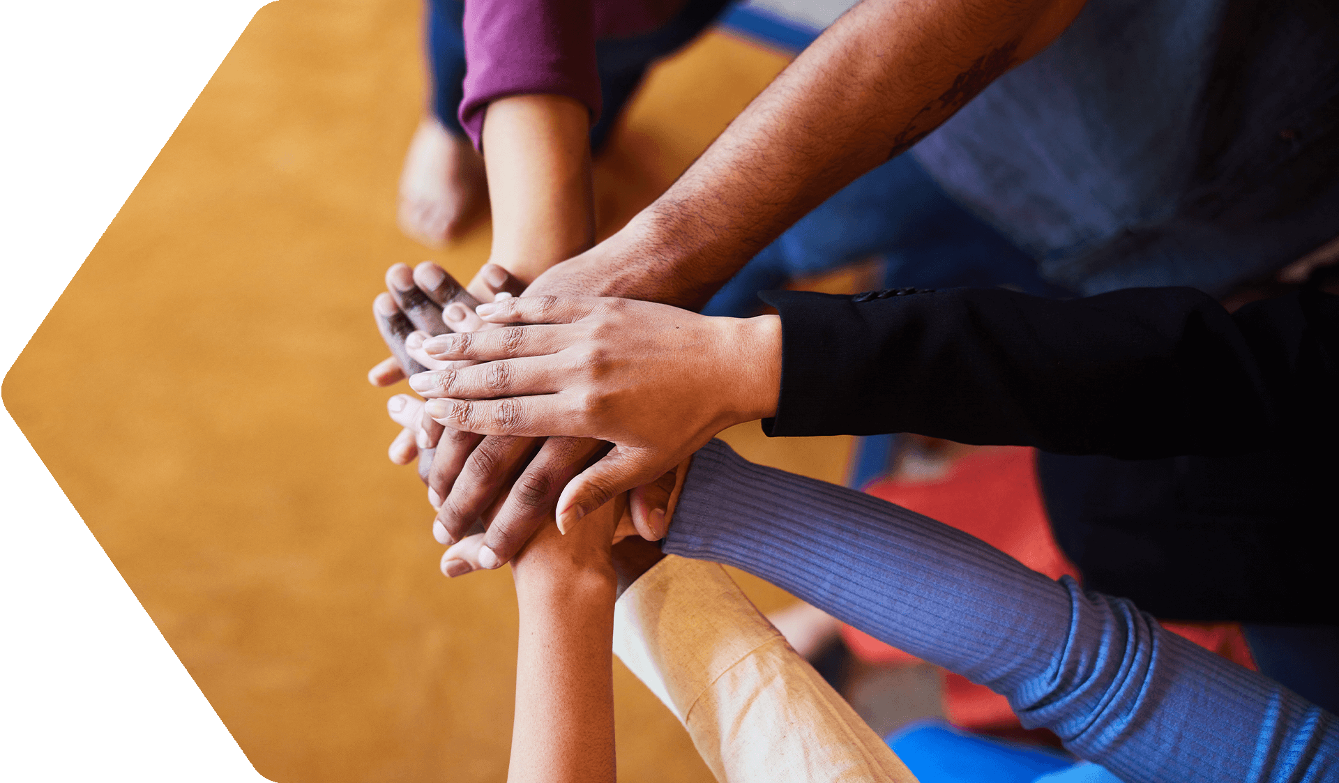 Diverse businesspeople standing with their hands together (1)